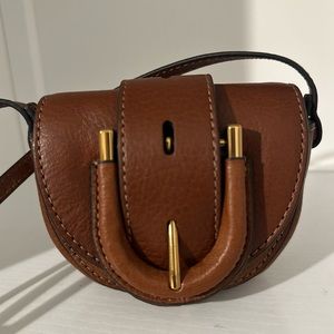 Fossil Harwell Mini Flap Crossbody Bag and the Fossil Heritage Trifold.